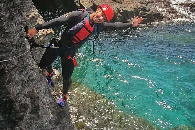 Coasteering experience in Gran Canaria - Stop at Mogán: Jumps, Swimming, and a Cave Zipline Moment