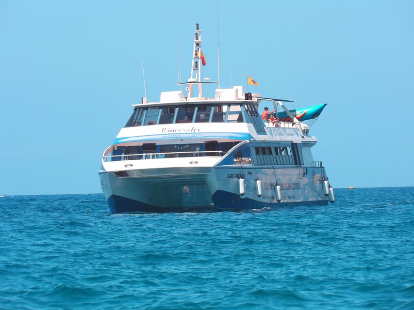 From Puerto Rico: Boat trip along the coast w/ Food & Drinks - Water sports and add-ons: banana included, jetski and parasailing optional