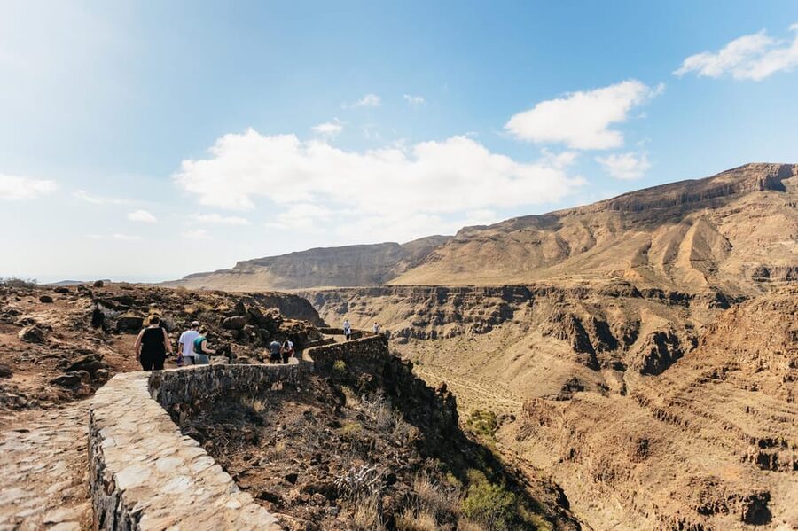 Gran Canaria: The Red Canyon Tour with Local Food Tasting - Arinaga Swim Stop: The Refreshing Reset at the Coast